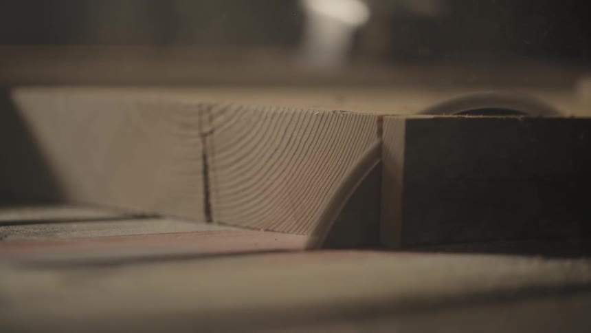 A plank of wood is cut