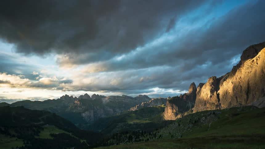 Time lapse of clouds moving across a mountain range