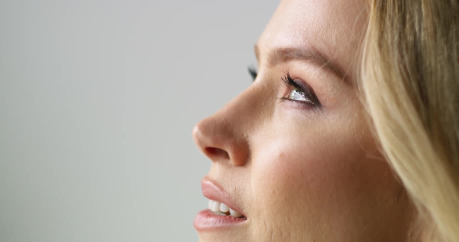 A woman is smiling indoors