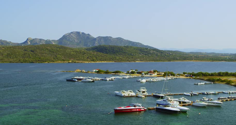 Wide shot zoom of a marina with boats in it