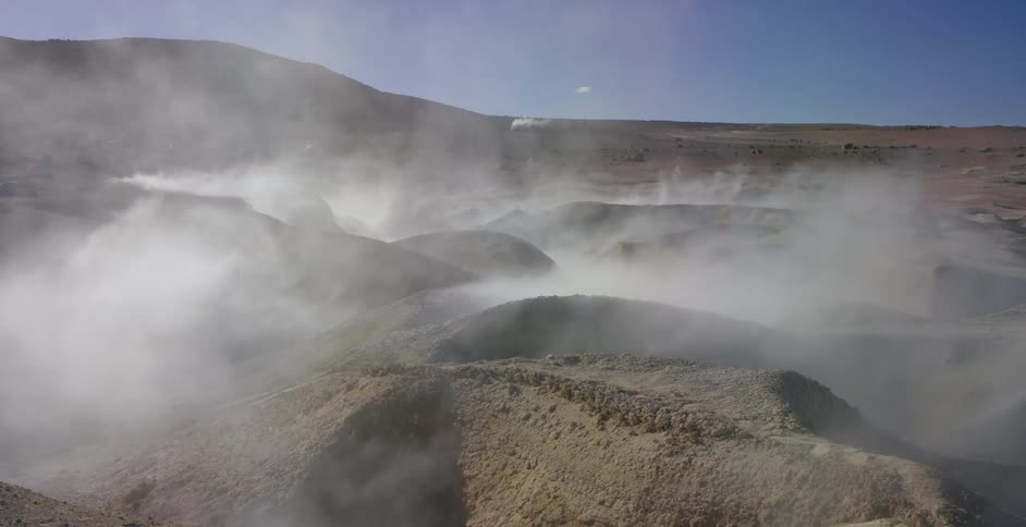 Steam coming out of a volcanic area in a rocky area