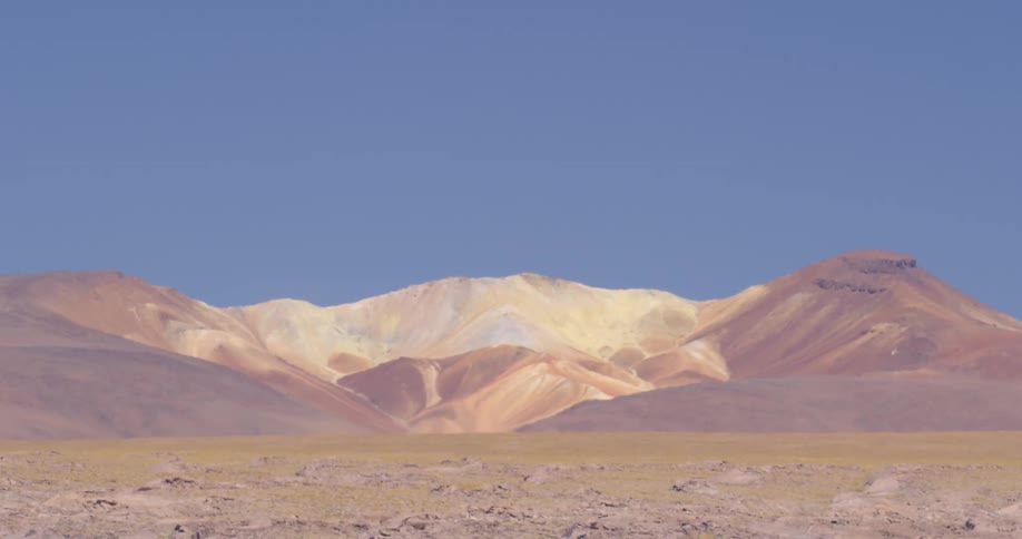 A mountain range is displayed in the distance