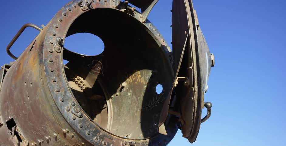 A large vintage cannon is on display on a sunny day outdoors