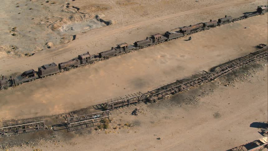 A derelict train abandoned in the desert