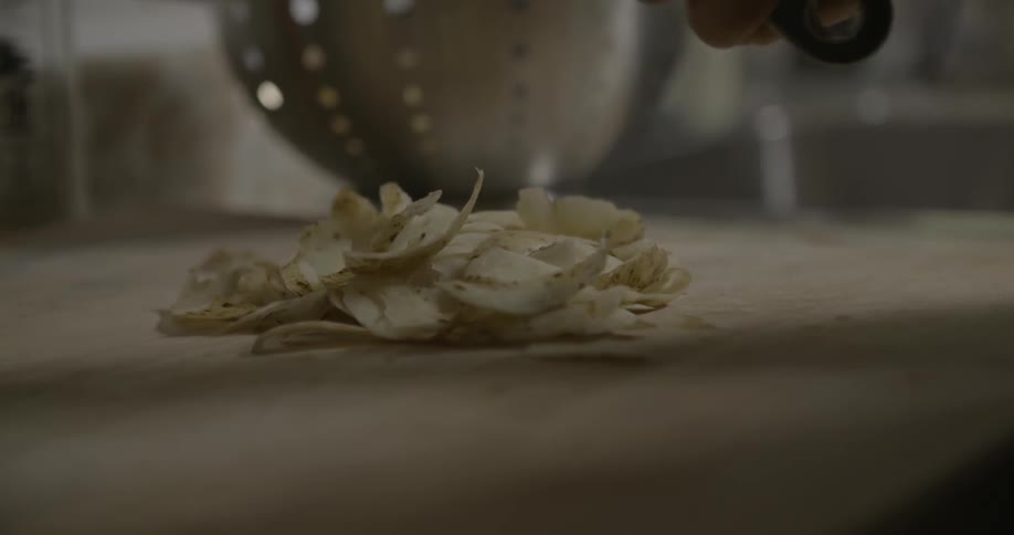 A woman peeling potatoes