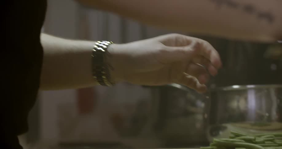 A woman is preparing food in a kitchen
