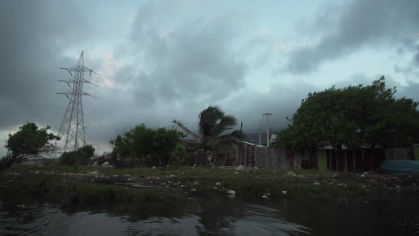 Buildings are shown during a storm
