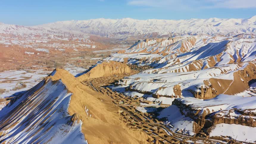 Aerial view of snow covered mountains