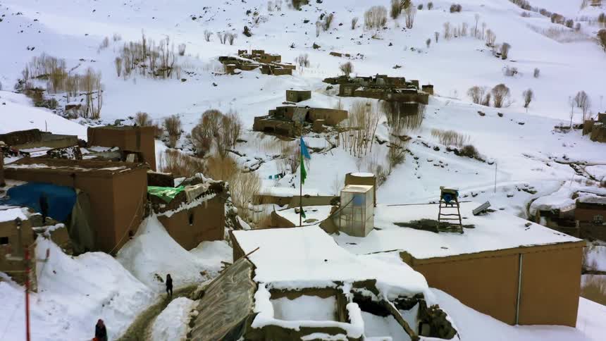 The rural town is covered in snow