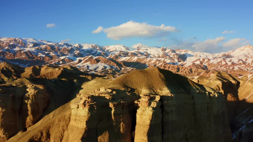 An aerial view of a canyon is displayed at dusk