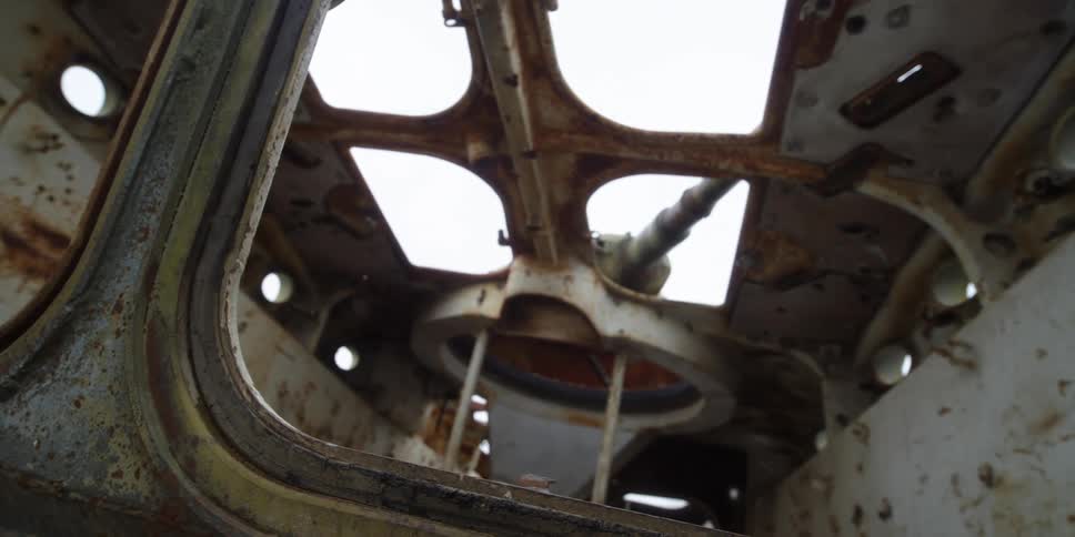 Rust covers metal vehicle with windows not containing glass