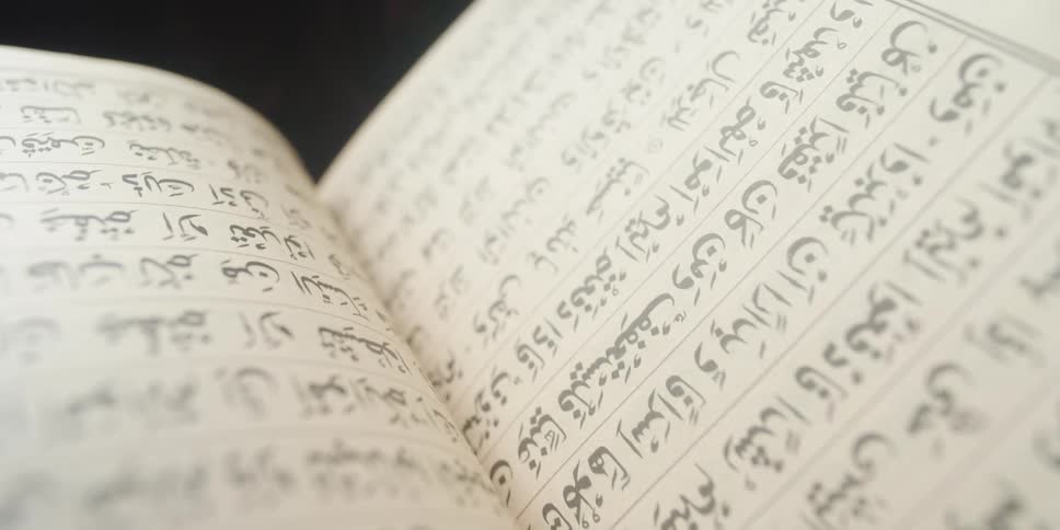 Book open to show handwritten writing
