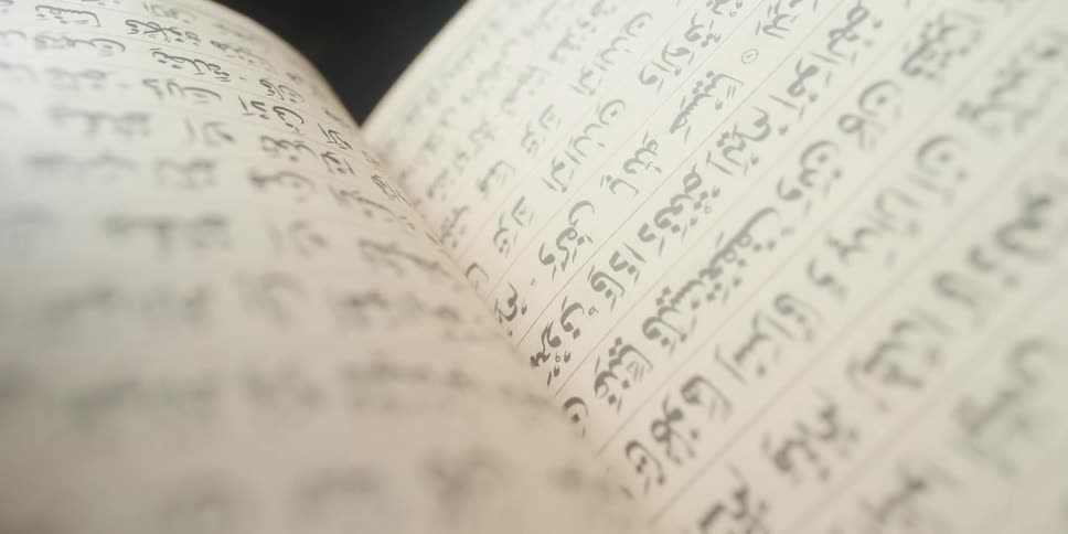 An open book with text covering the pages