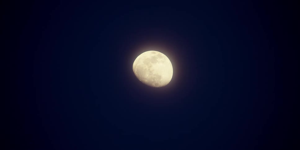 The moon glowing in a night sky