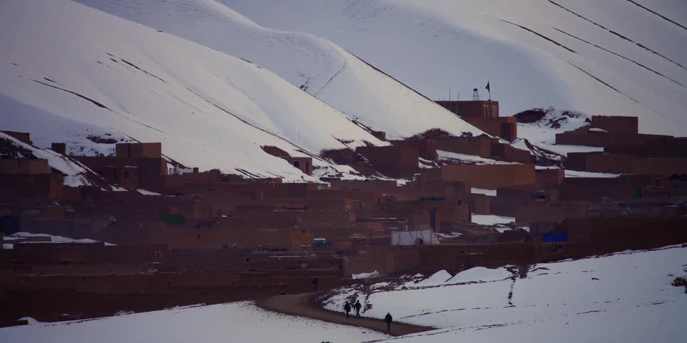 Group of people are walking outdoors at winter