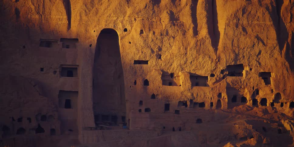 Doorways and windows are carved into the side of a mountain