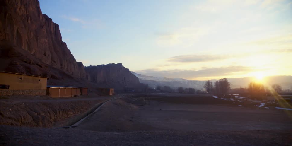 A small building is on the side of the mountain