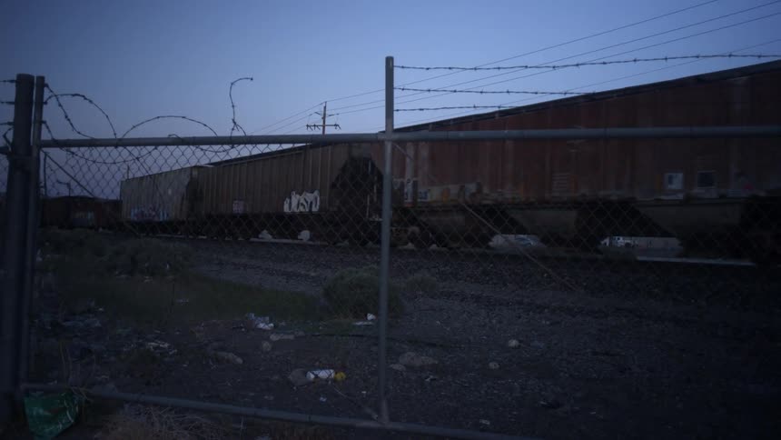 Cargo containers are traveling on the train track