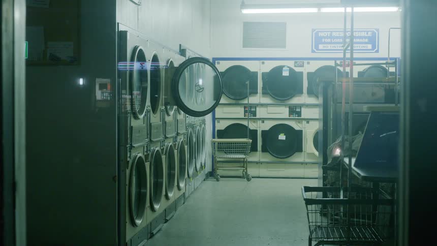 View of an empty laundromat at night