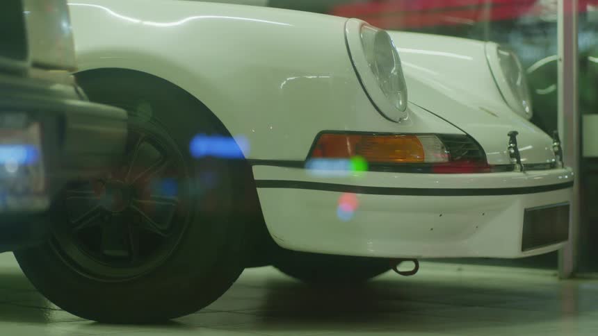 A sports car sits in the shop