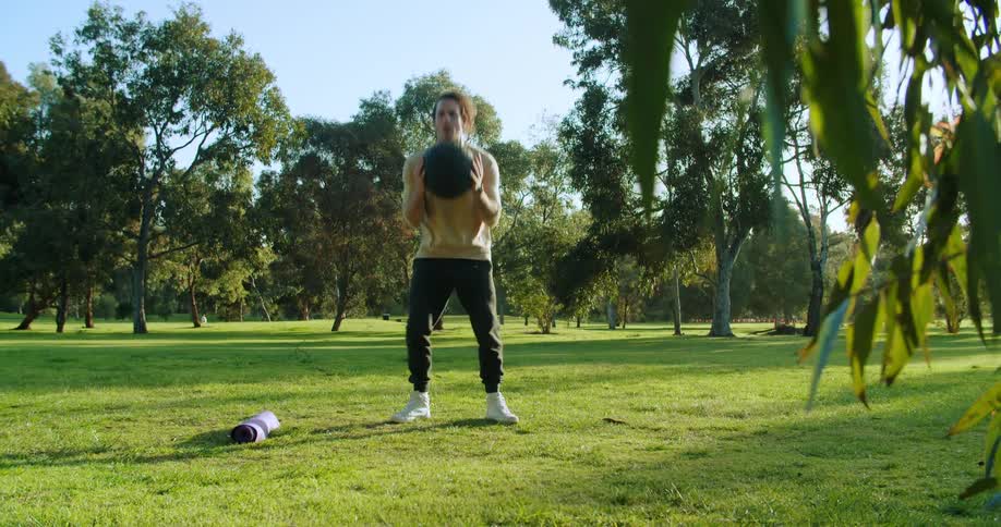 A man is exercising outdoors in spring