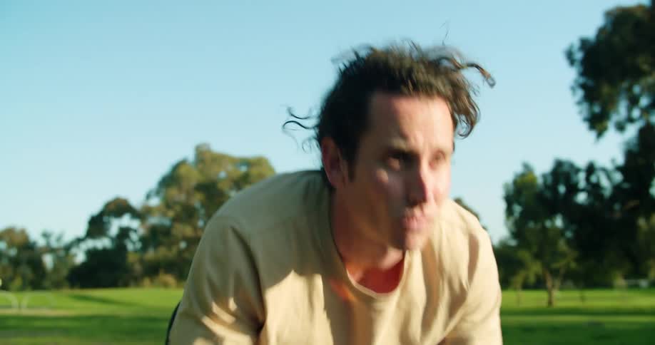 A man is exercising outdoors in spring