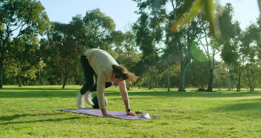 A man exercising in a public park