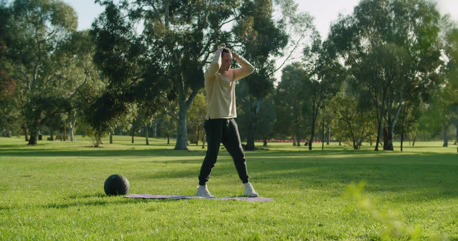 A man is exercising outdoors in spring