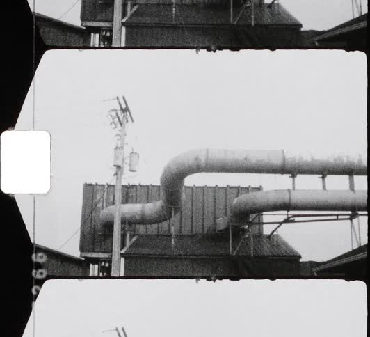 Pipes run from the top of the factory