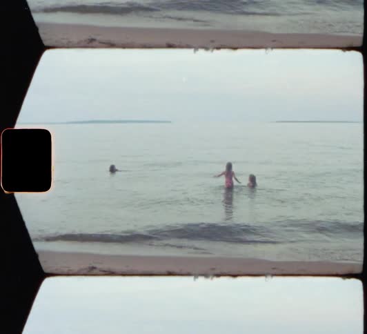 Children at the beach playing in the water