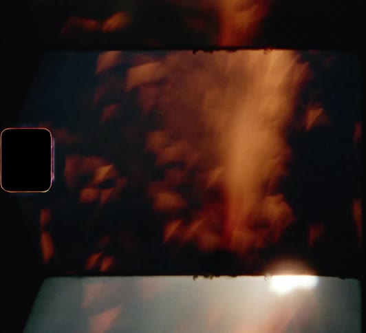 Flame and fire burning with a body of water in the background
