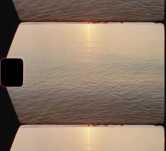 The sun is setting over the water 8mm