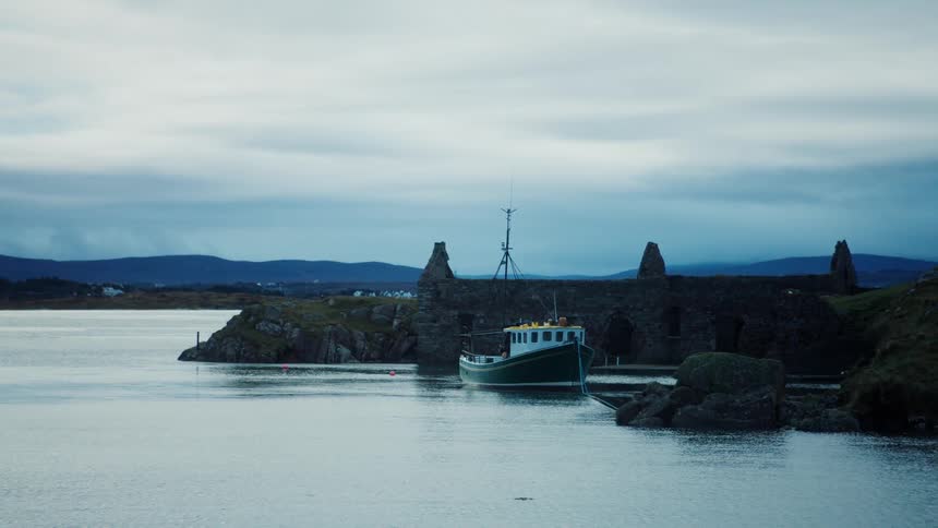 A boat docked at the shore