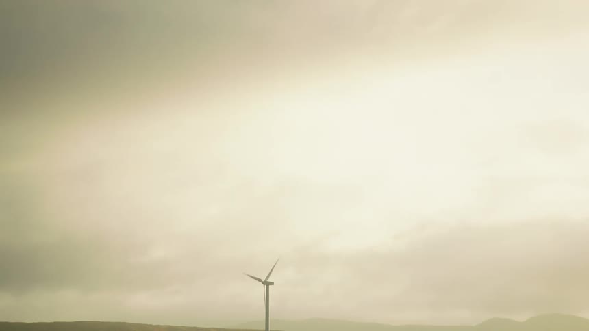 A windmill blowing in the wind