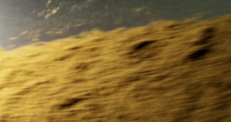 Sand flying down a black chute