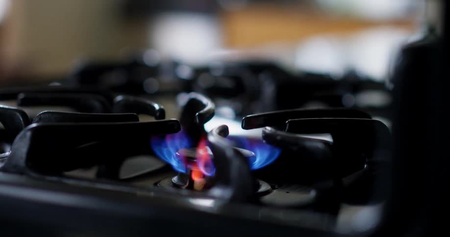 The stove flame is turned on
