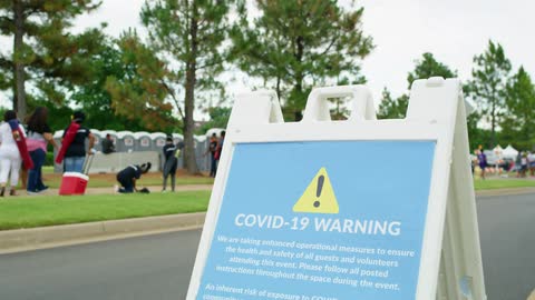 People wait at a covid19 testing site