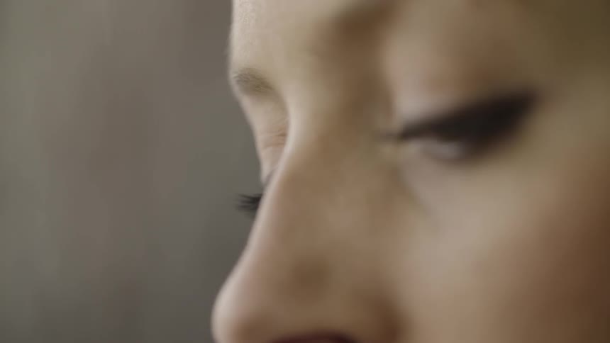 Close up of a woman's face looking down
