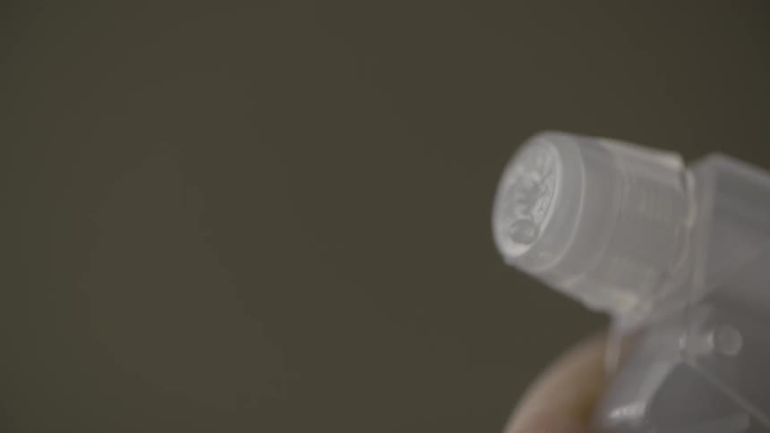 Liquid spraying out of a spray bottle