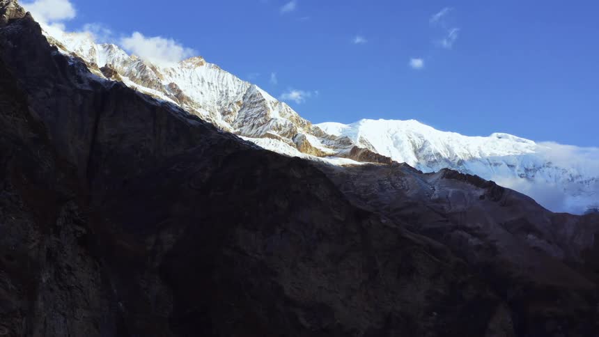 Aerial view of a mountain is displayed in winter