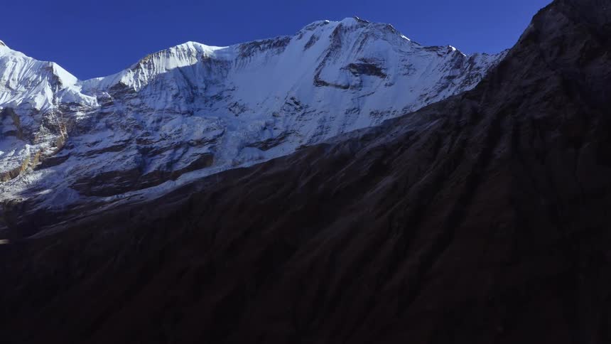 A snowy mountain range in the wilderness on a winter day