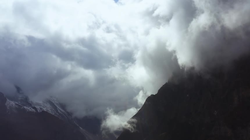 Clouds moving over a mountain range