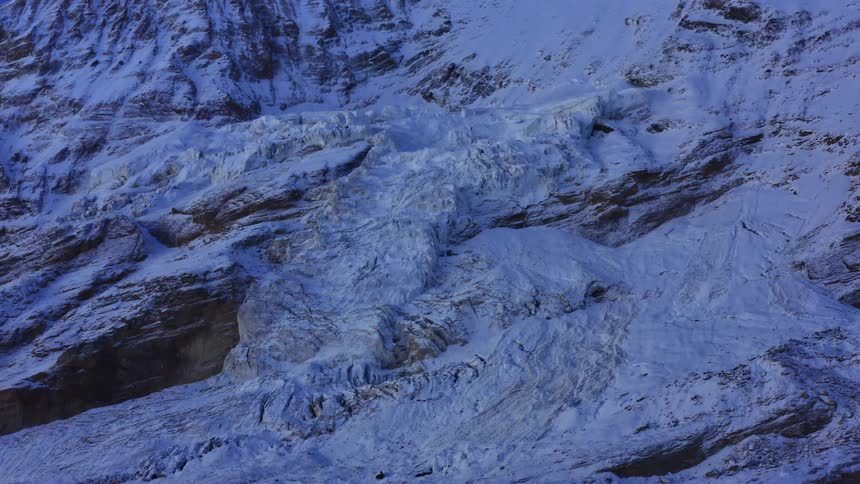 An aerial view of an arctic landscape is displayed