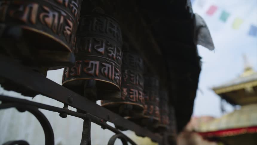 A chime in front of the church spins in the wind