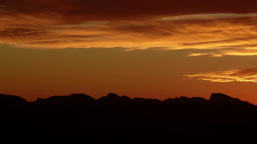 The sun is setting in the horizon