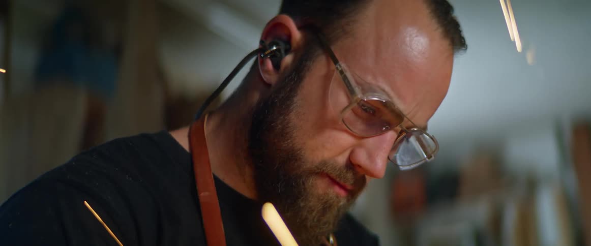 Sparks fly as a man in his garage works