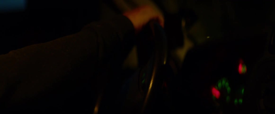 A man shifts gears in a vehicle before accelerating