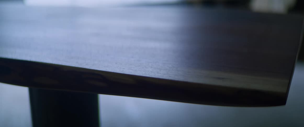 Close up of a coffee table in a home in front of a window