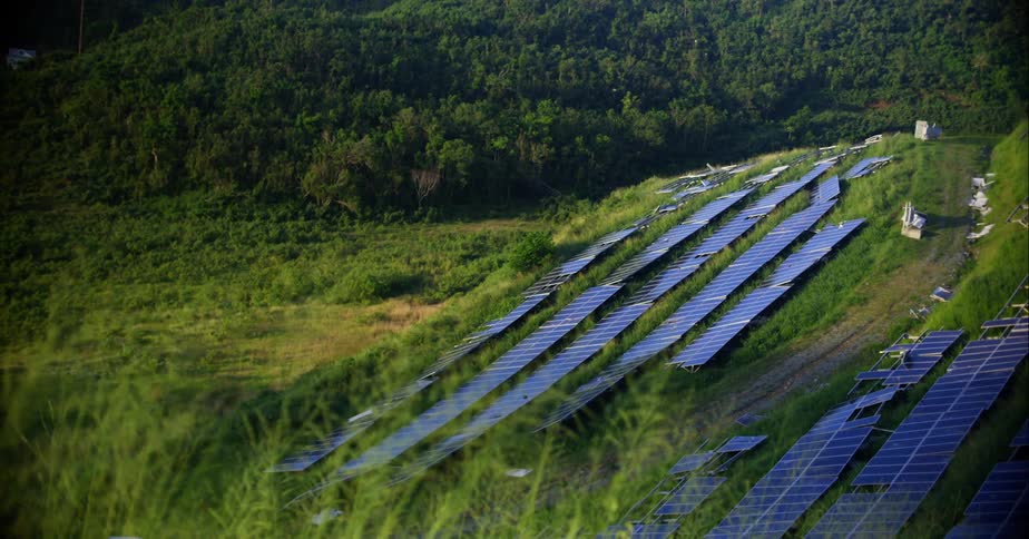A small solar farm in the countryside during the day