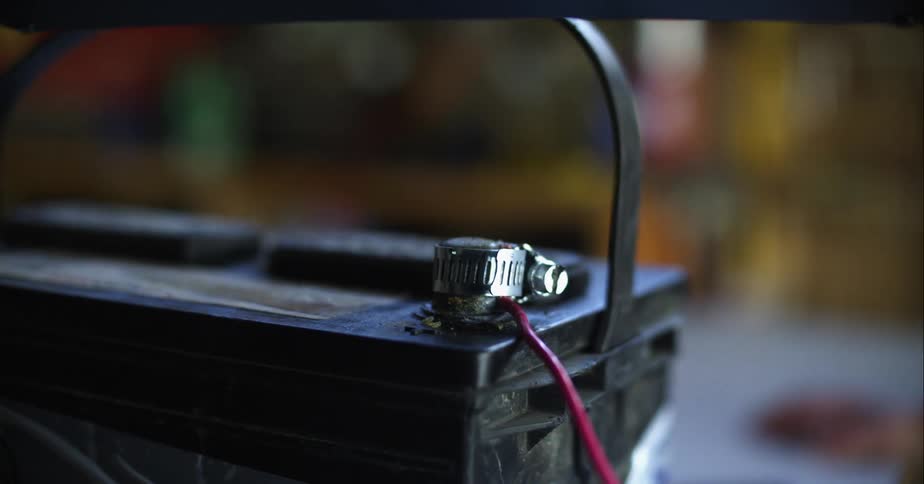 A person reaching for a battery